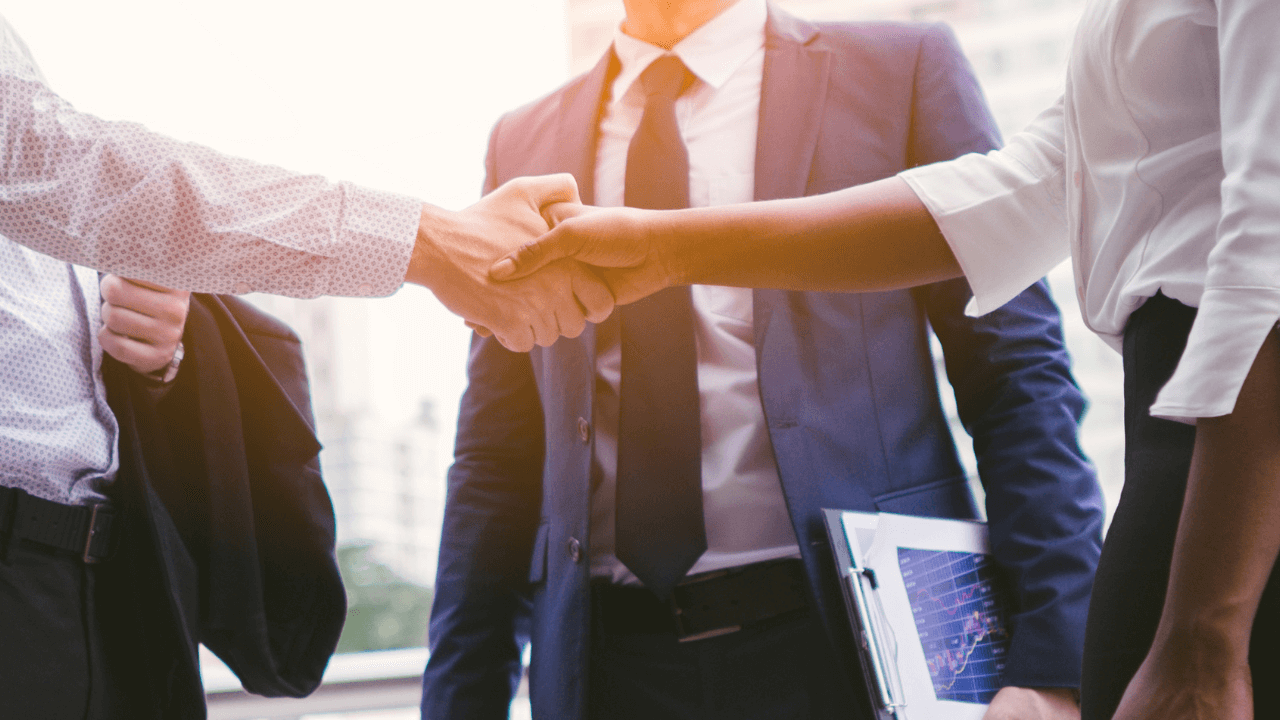 Business man and woman shaking hands