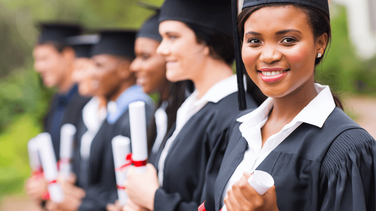 University graduates holding degree