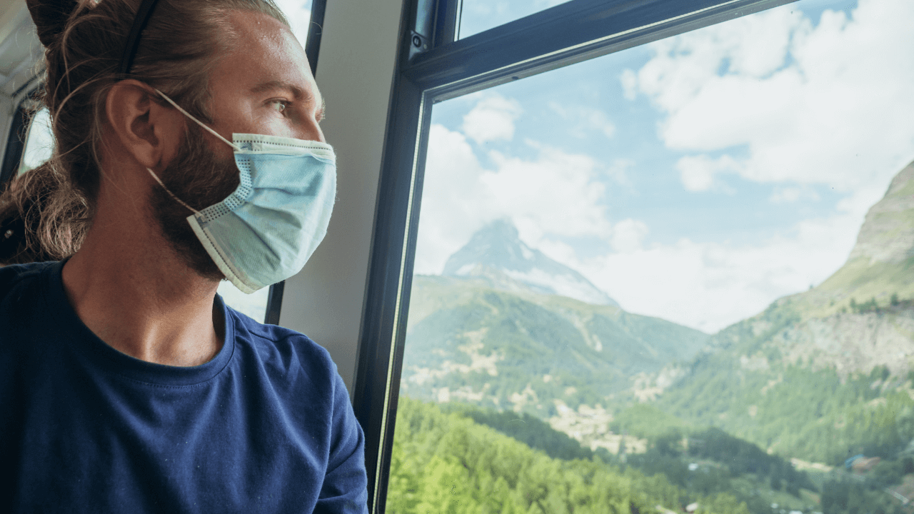 Man travelling during Covid 19 with a mask on