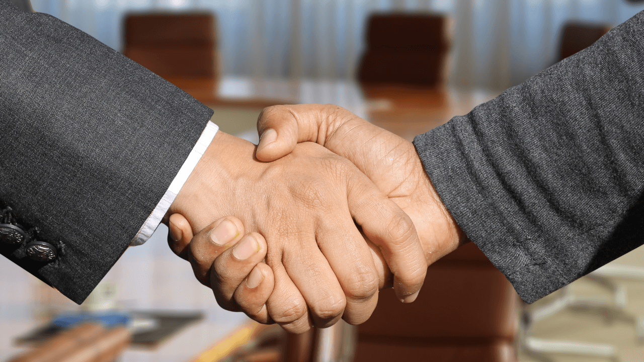 Two business partners shaking hands