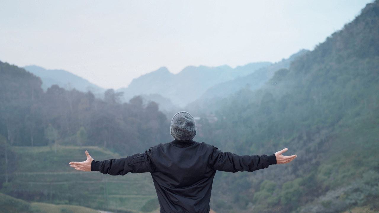 man celebrating a beautiful view