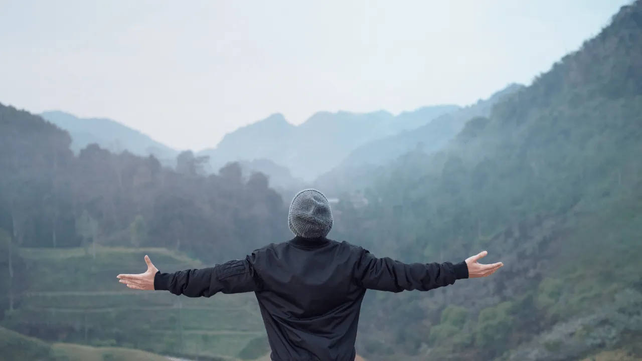 man celebrating a beautiful view