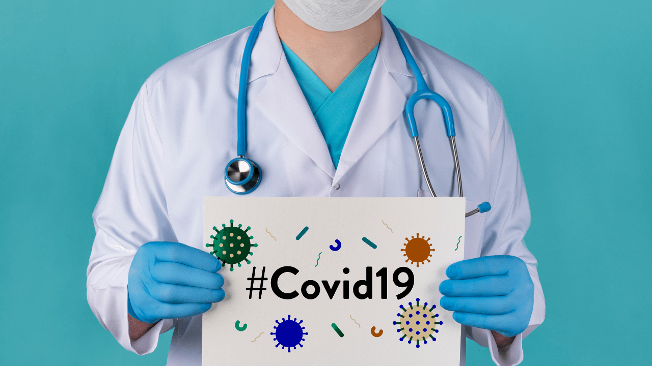 Doctor holding a Covid-19 Sign