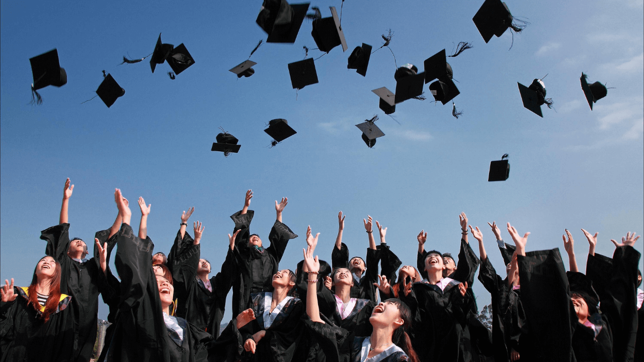 Students throwing their caps at graduation