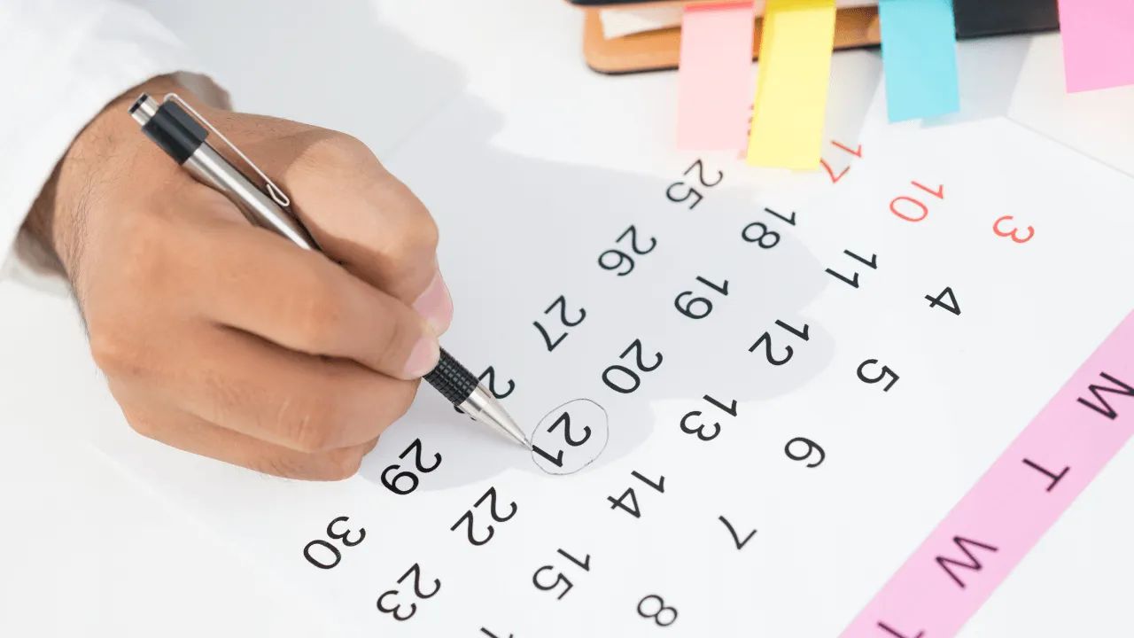 Man scheduling on a calendar