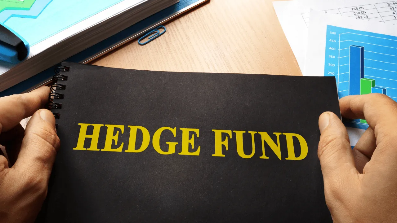 Man holding hedge fund binder