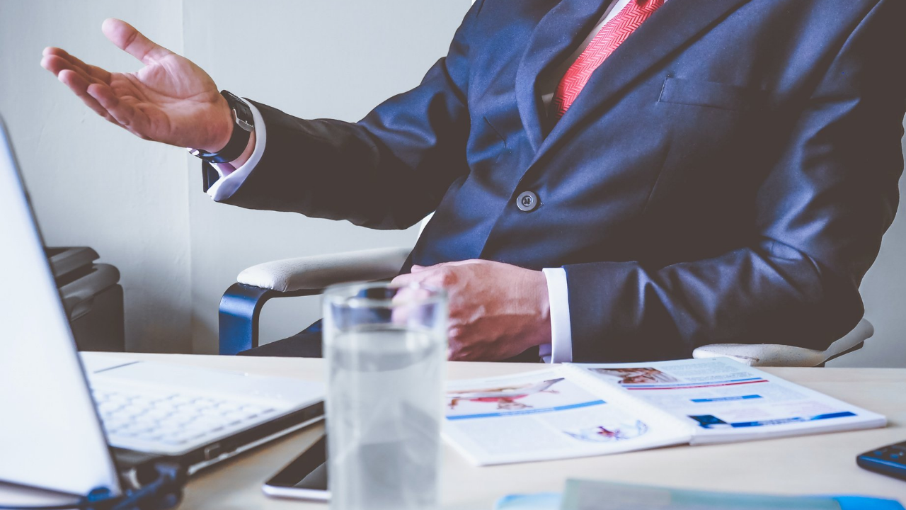 Business man working at his desk with his laptop off