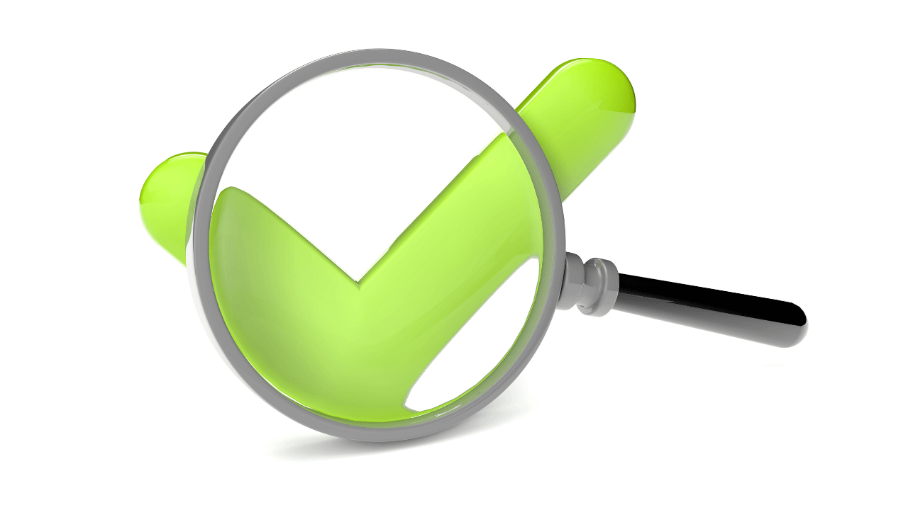 A green check mark and magnifying glass