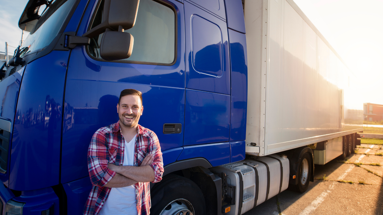 Truck driver standing outside his truck