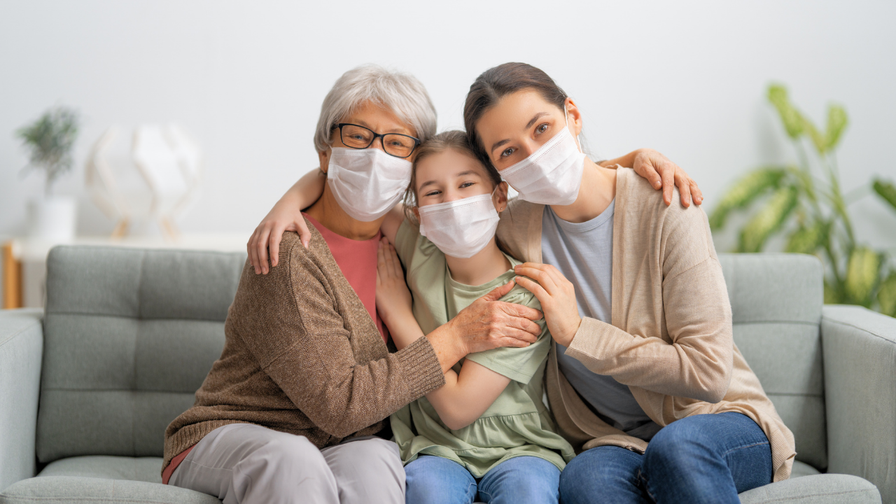 a happy family wearing masks