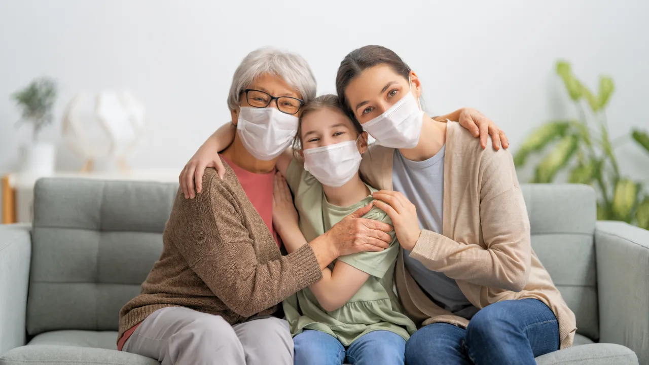 a happy family wearing masks