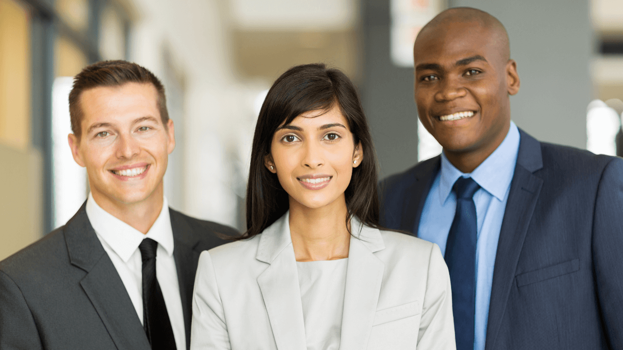 3 entrepreneurs smiling in their business attire