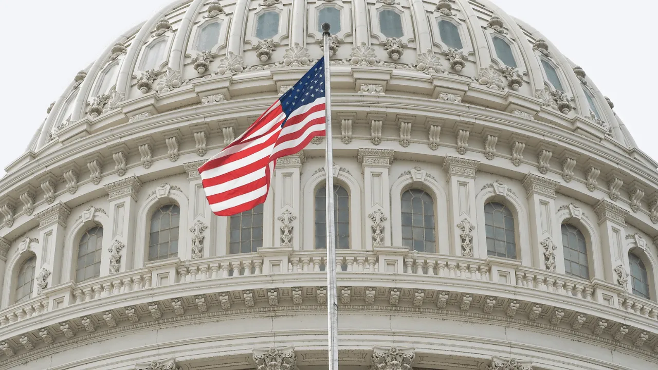A US flag post in front of a parliament building