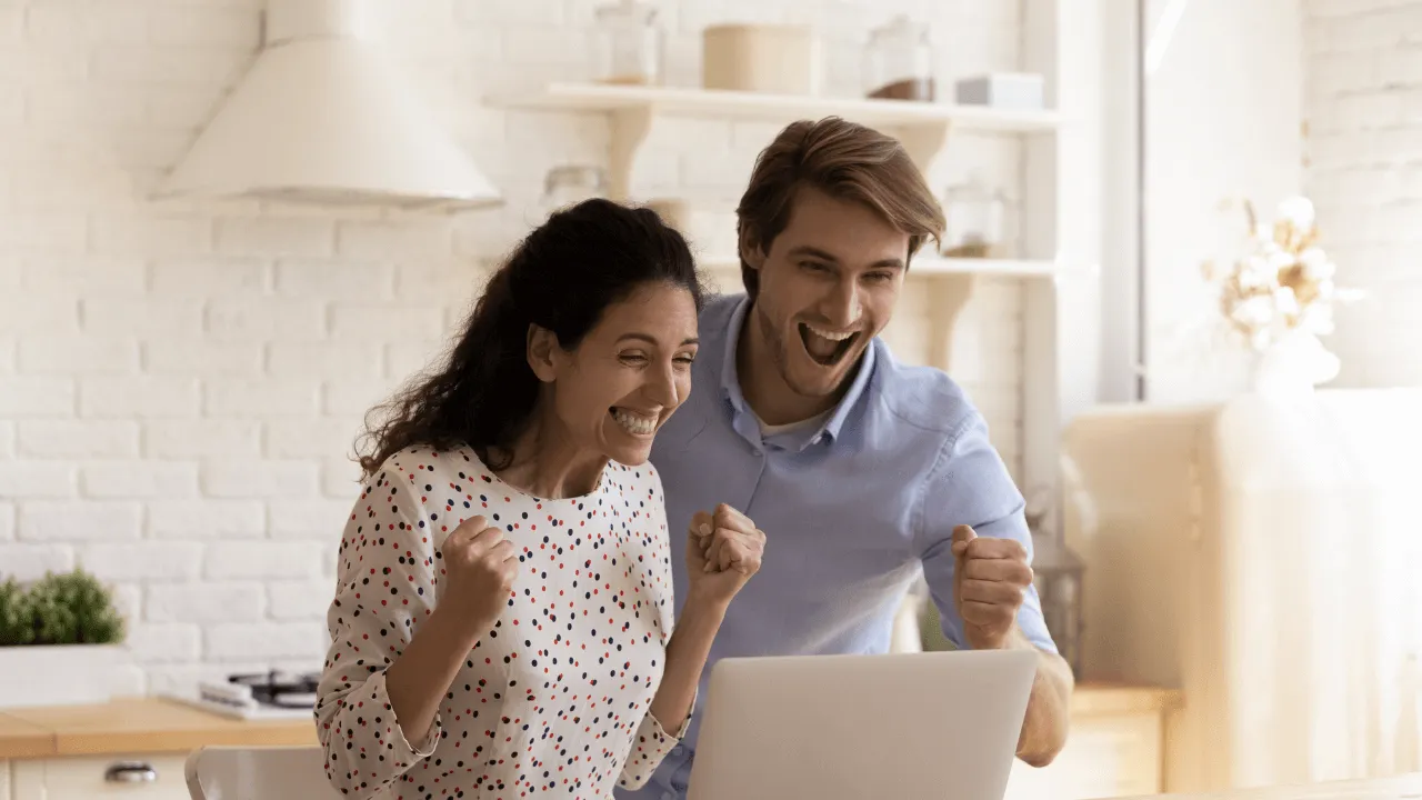 Two people celebrating an approval
