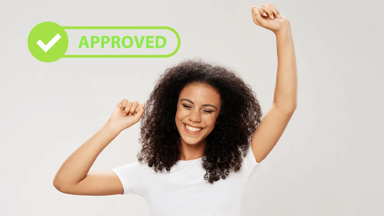 A woman celebrating her most recent approval