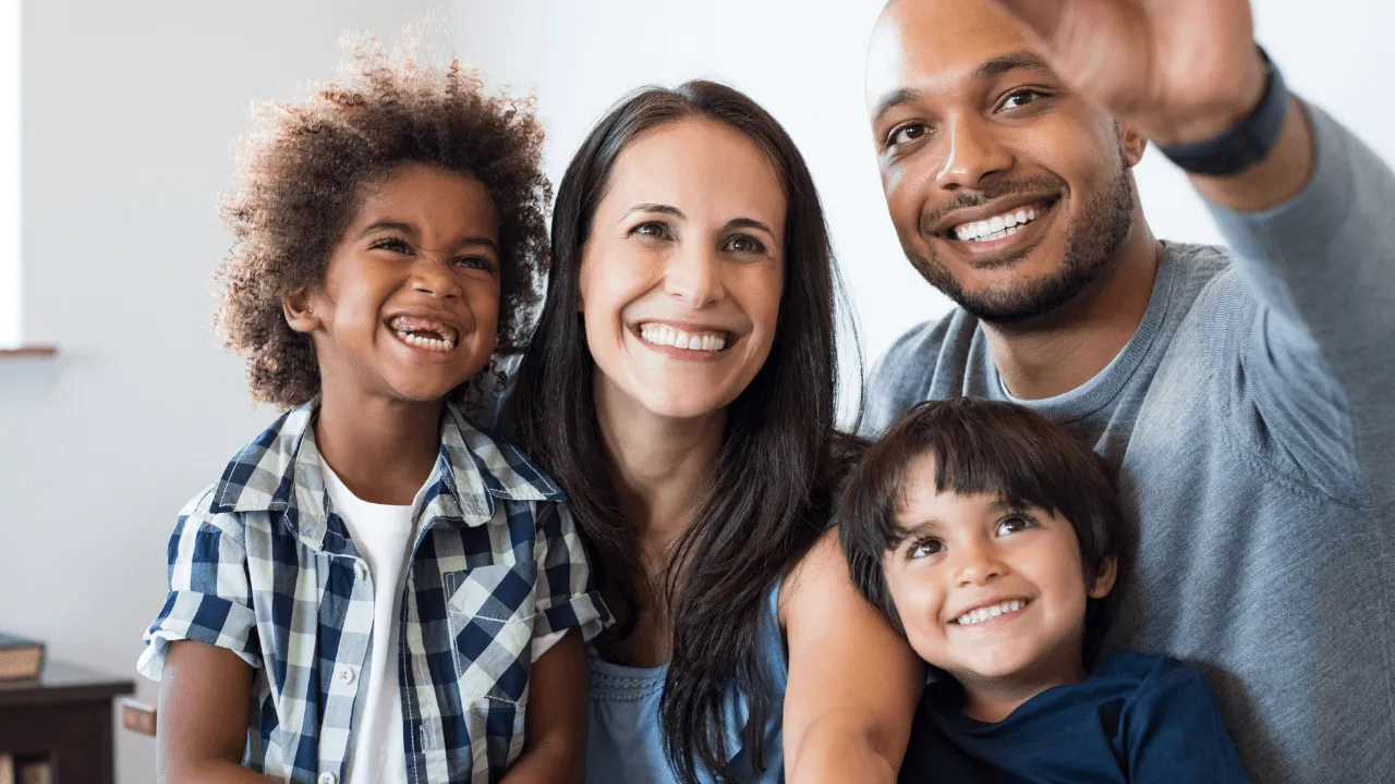 A family of 4 taking a selfie together