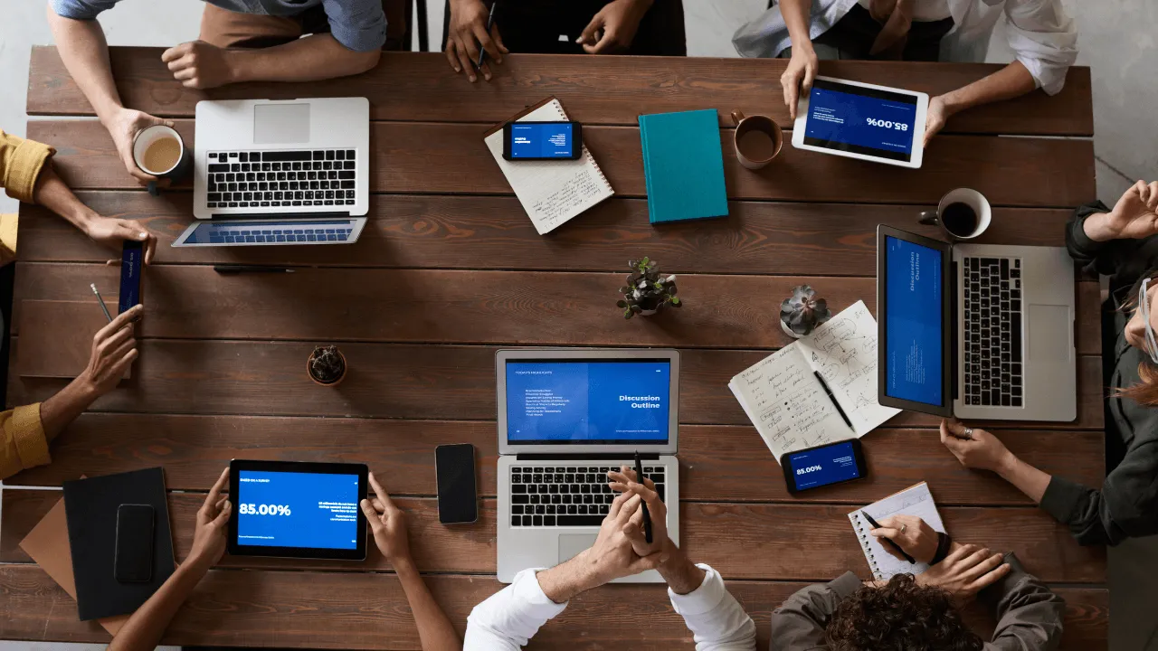 An office team sitting around a conference table