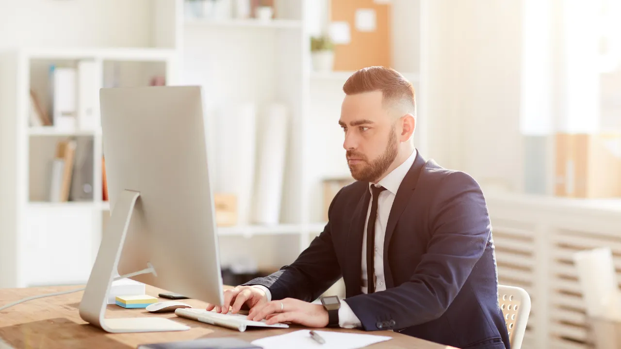 A business man working on the computer in his work from home office