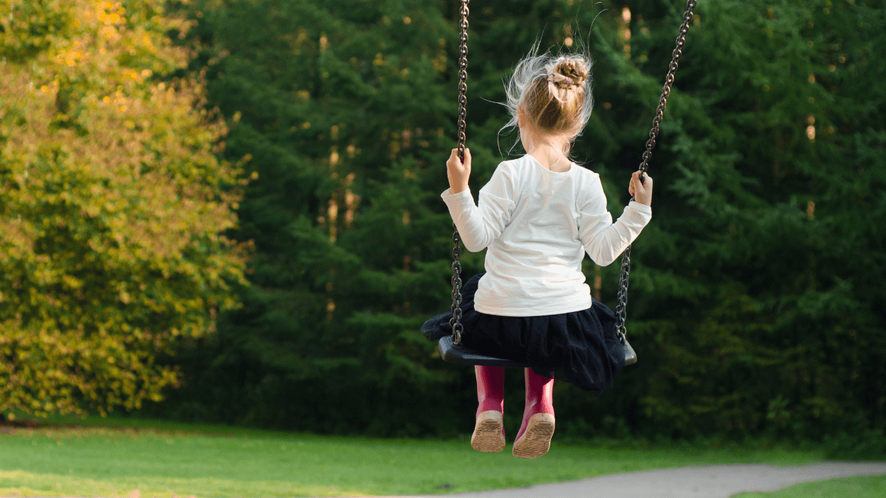 A child swinging on a swing