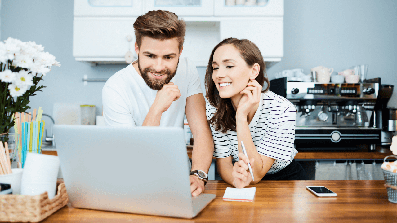 An owner and executive working on a laptop