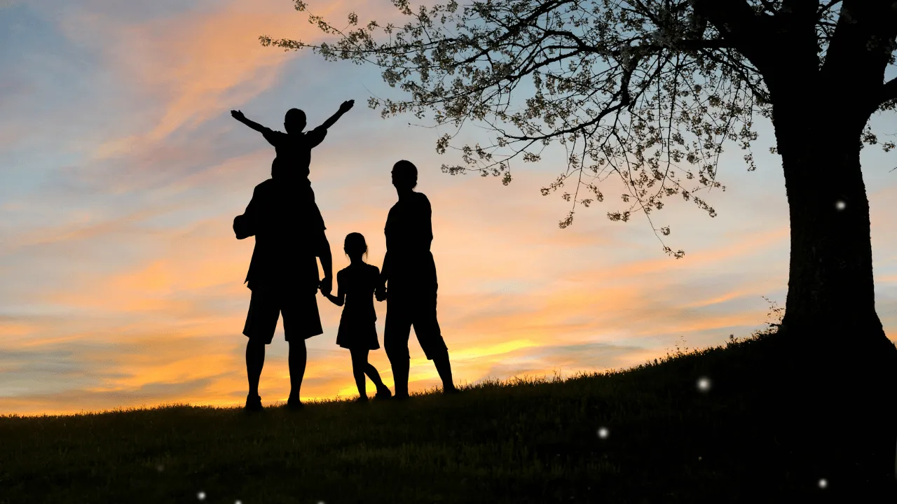 A family standing under a tree