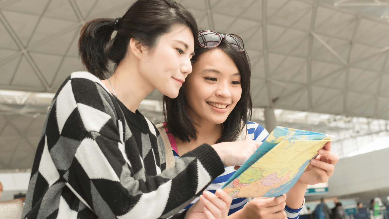 Two women consulting a map