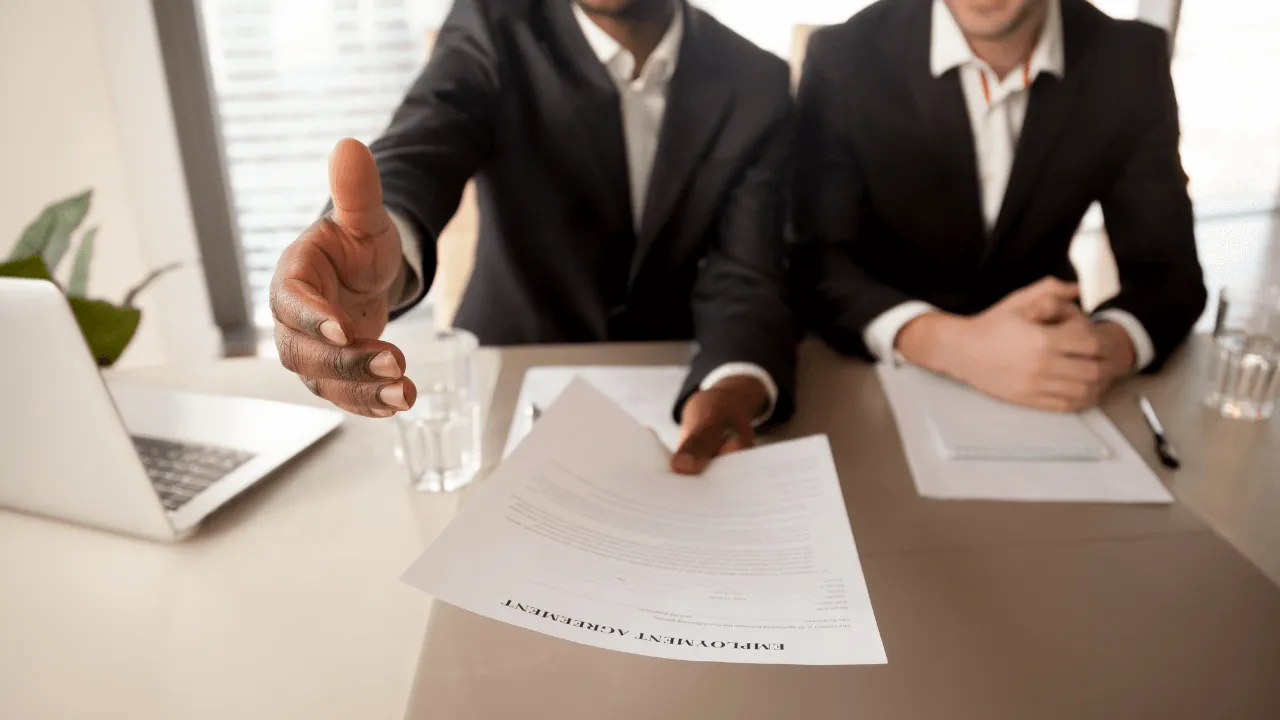 Employers congratulating a member who is new to join the team