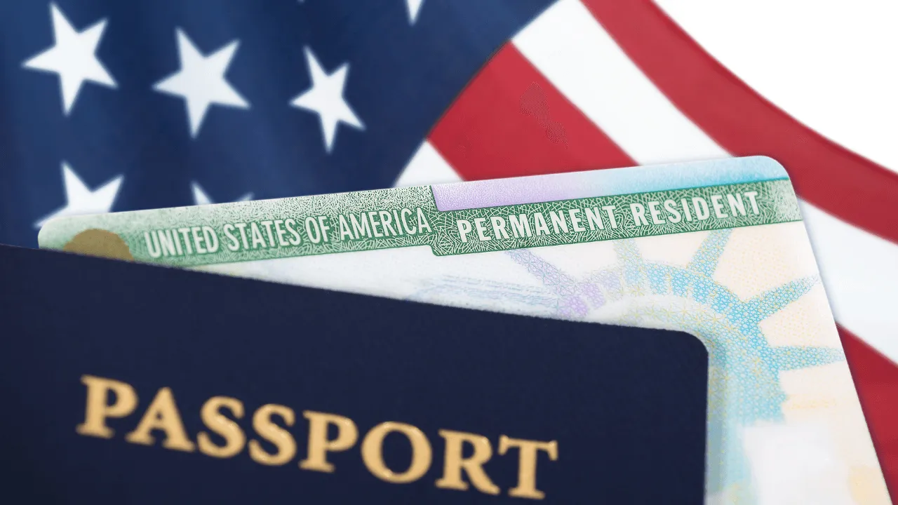 A passport and green card with the USA flag