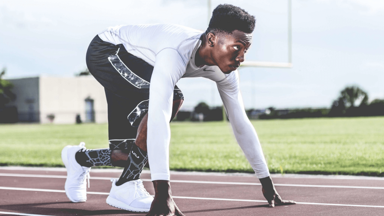 An athlete getting ready to run track