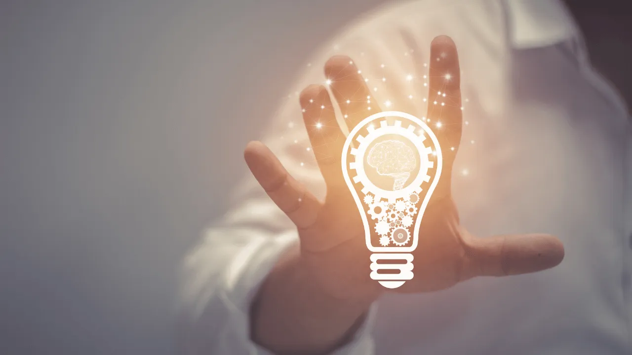 A man holding a light bulb