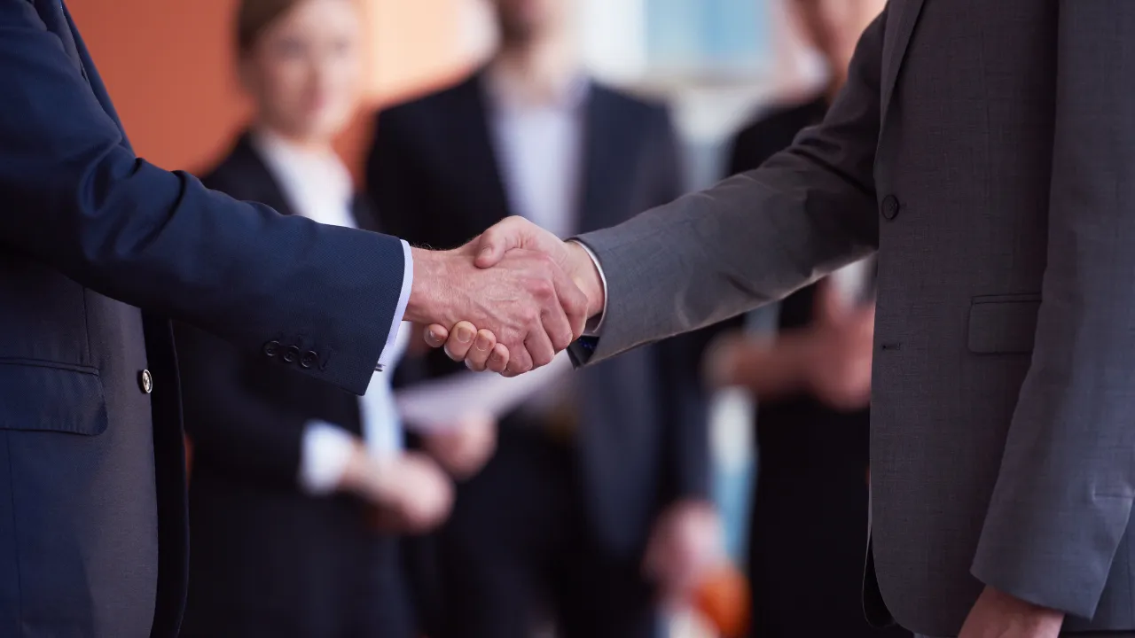Business partners shaking hands