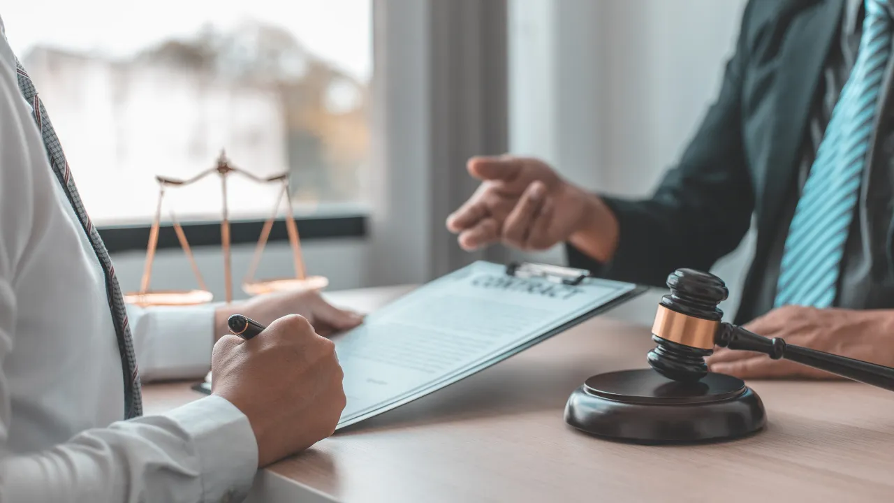 A woman consulting her lawyer in his office