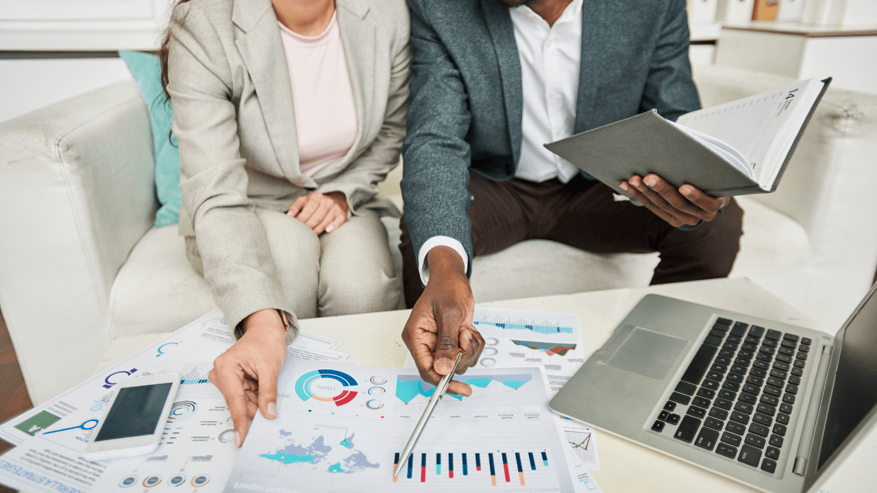 A man and woman collaborating on a business project