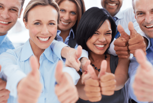 A group of people giving thumbs up