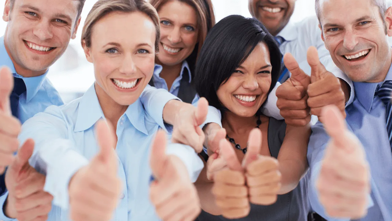 A group of people giving thumbs up