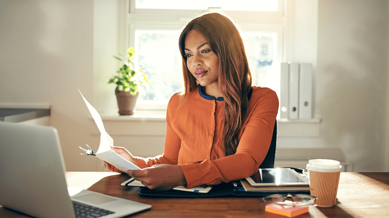 A female entrepreneur working on her laptop in her office