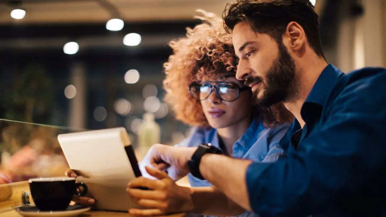 Two entrepreneurs looking at an idea on their ipad