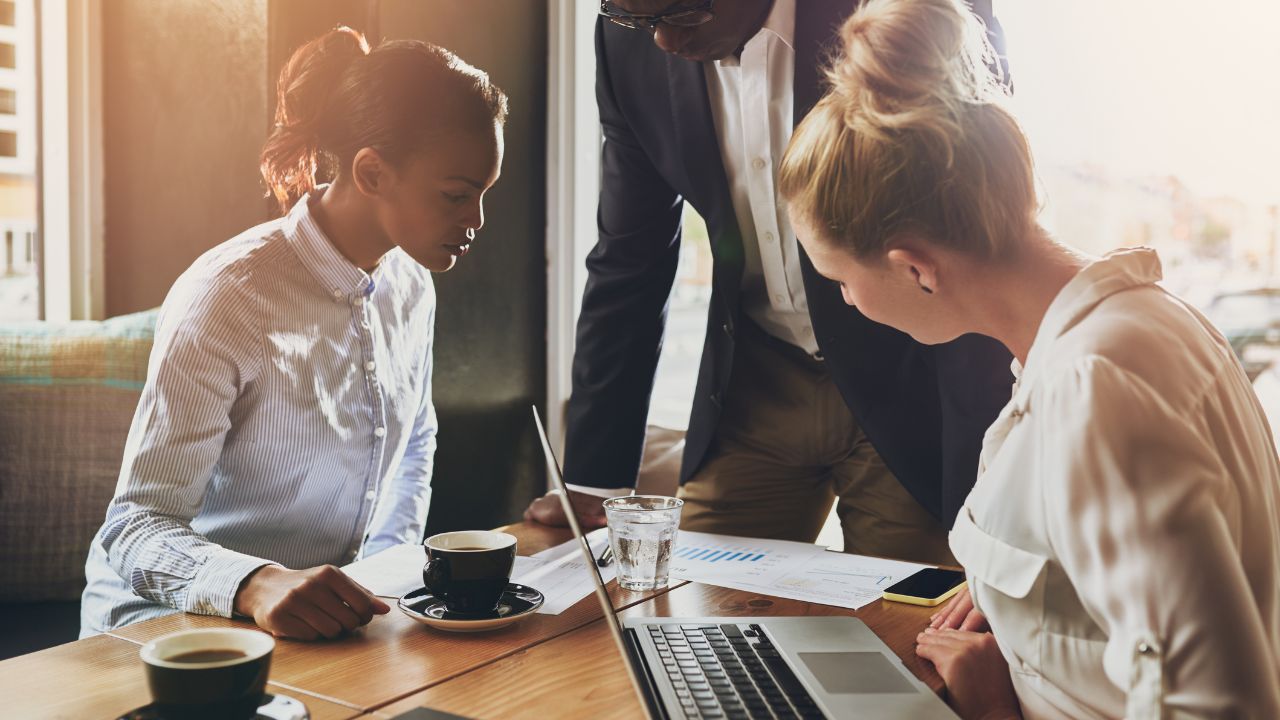 Three team members working together