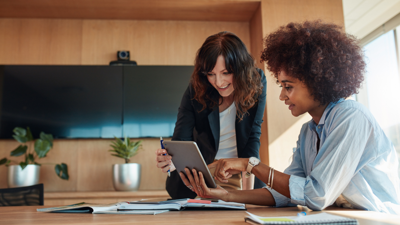 Two employees consulting with each other in the office