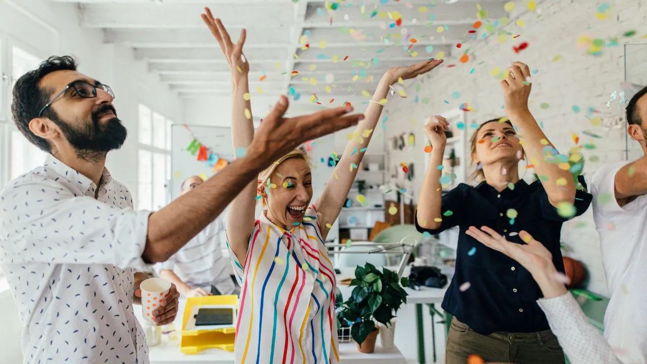 A team of 5 celebrating an exciting win!