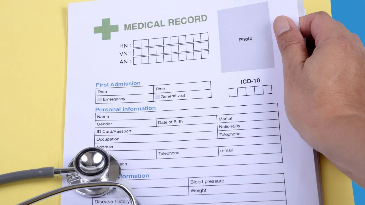 A doctor filling out a medical form