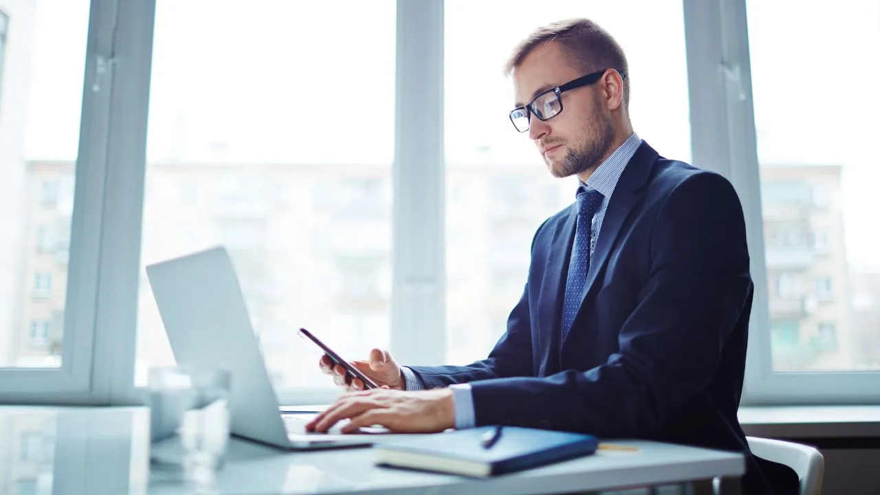 A business man on an L-1 working in his office