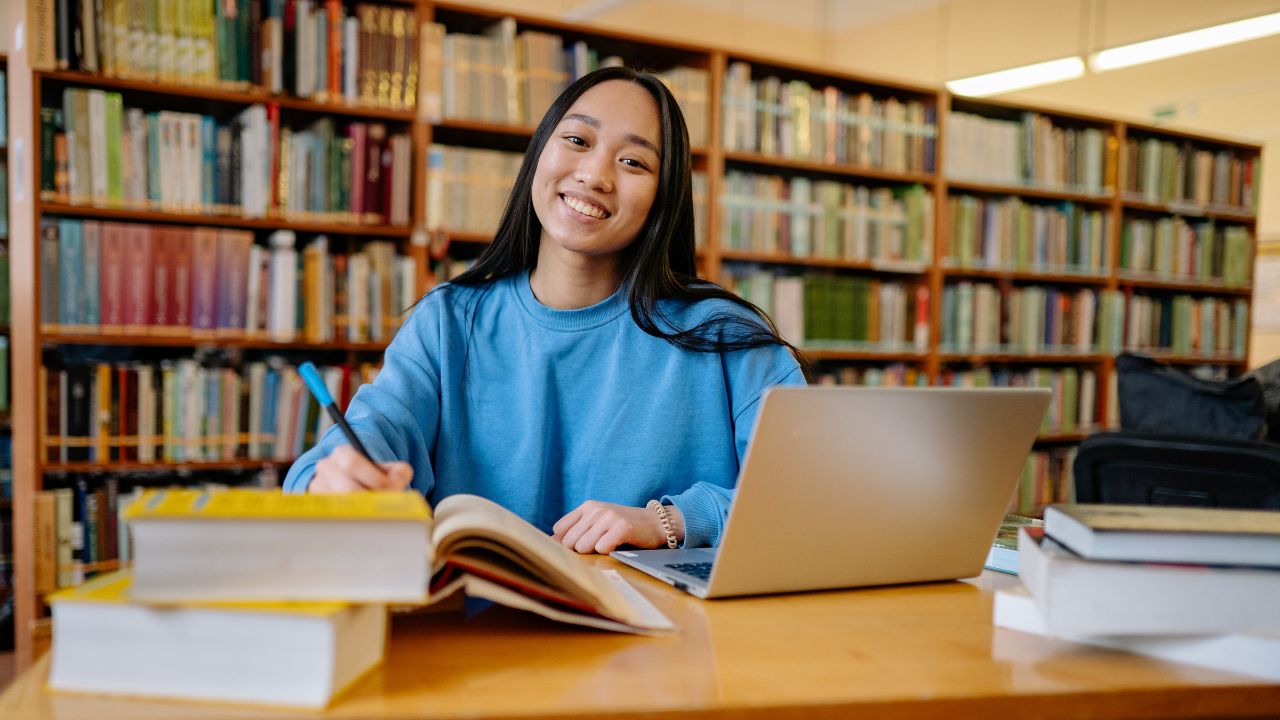 A student doing work in a library