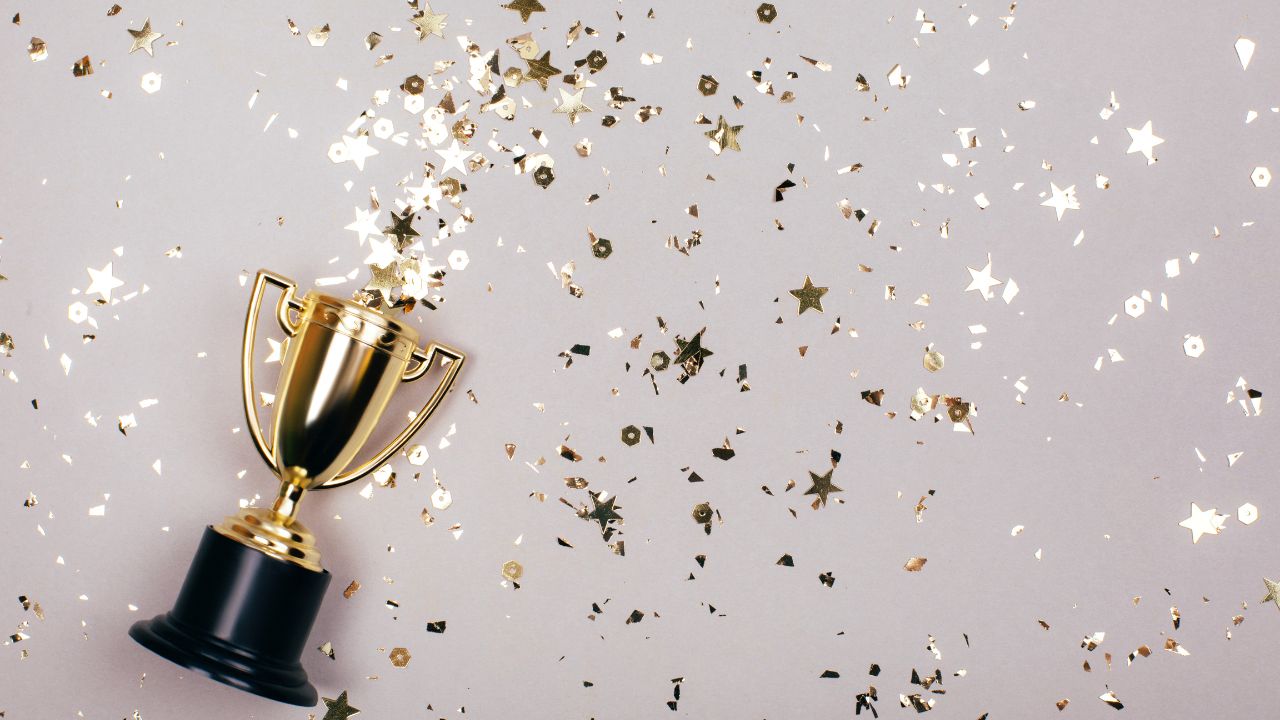 An award surrounded by confetti