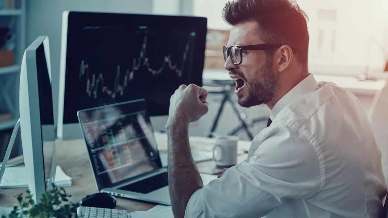 An investor celebrating a win