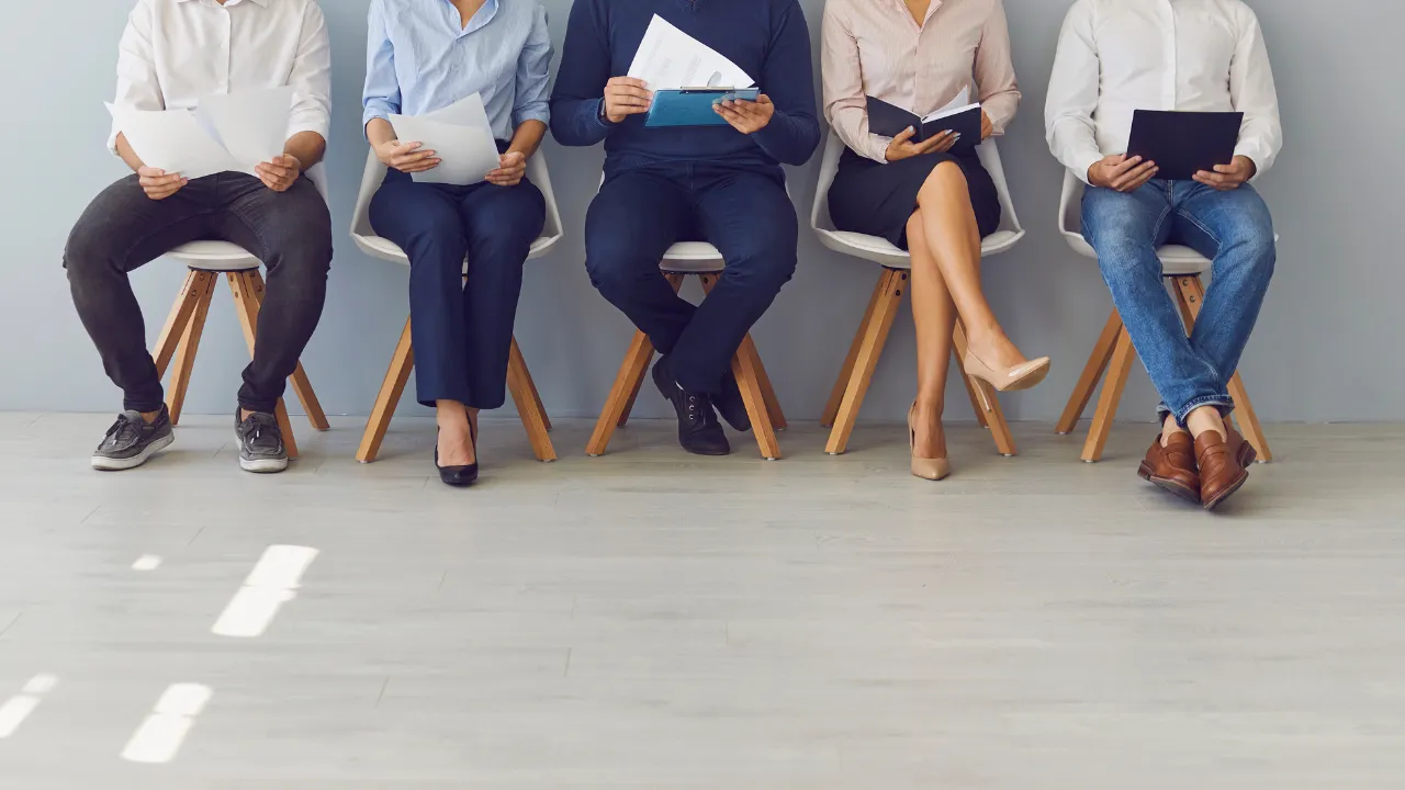 A group of people waiting to be interviewed