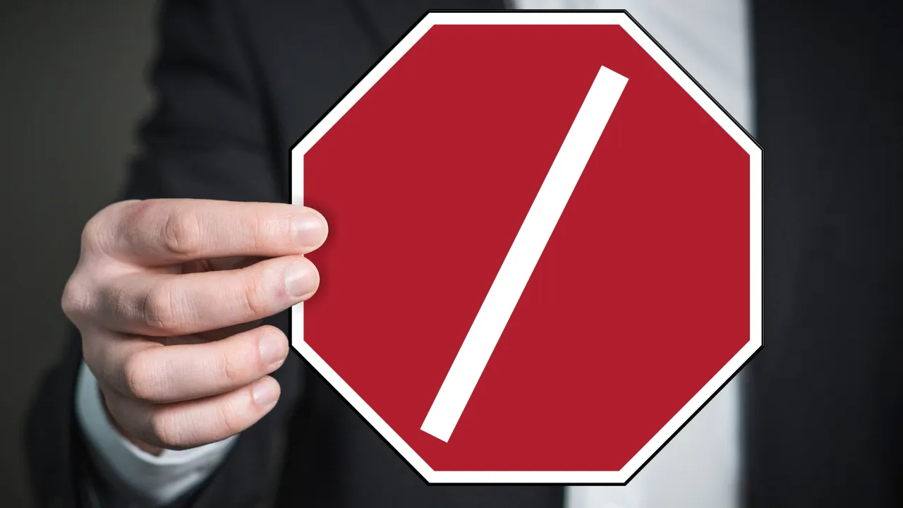 A man holding a stop sign