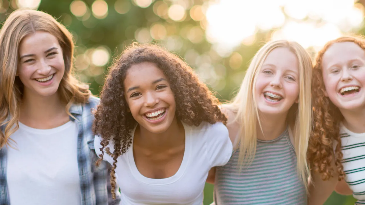 A group of teens smiling