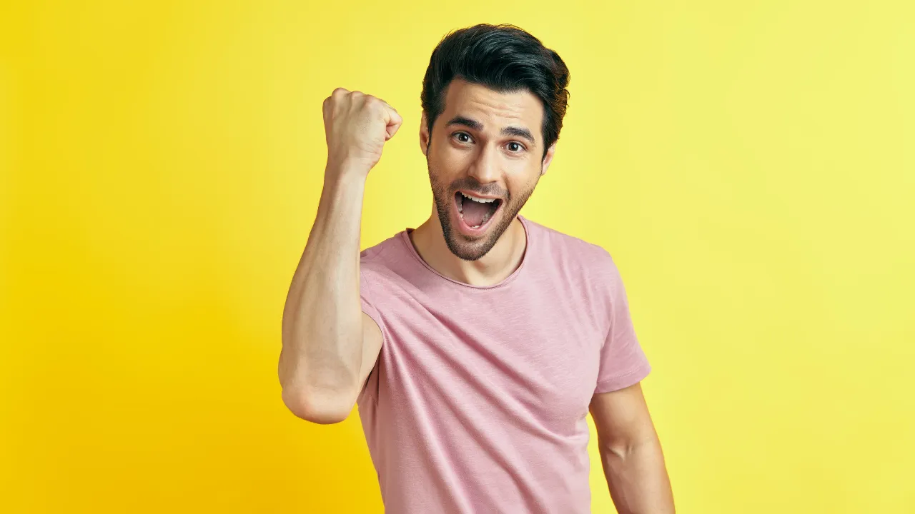 A happy man celebrating victory