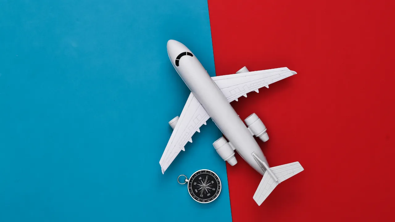 An airplane and compass